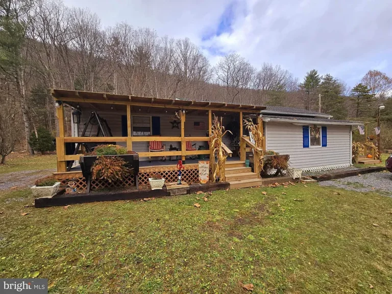 Escape to the serene beauty of the West Virginia Mountains in this charming 1-bedroom, 1-bathroom cabin with a guest house.