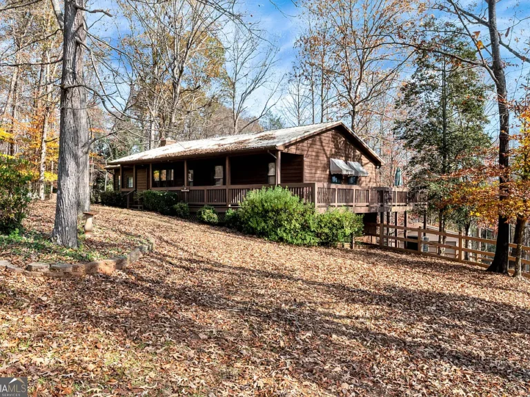 Discover this charming 3-bedroom, 2-bathroom cabin nestled in the woods.