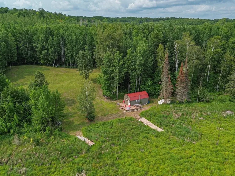 Lakeside Retreat: Charming Cabin on 27.25 Acres $140,000