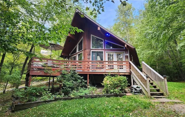 Chalet Home with Renovation Potential: Privacy, Open Concept & No Restrictions! $239,000
