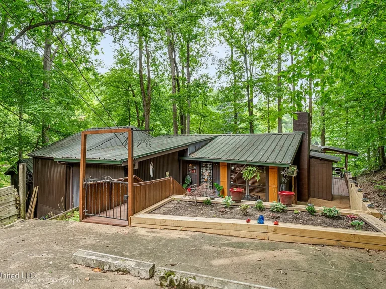 Lakeside Retreat: Lakefront Home with Boat and Boat House $179,900