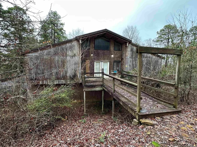 Spacious Home with 17-Car Garage on 18+ Acres $199,900