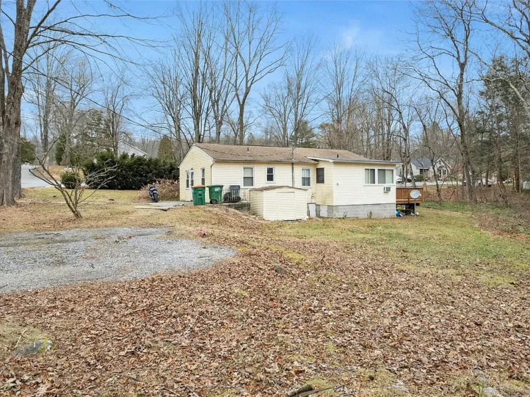 This lovely 2-bedroom home is situated on an oversized property, offering ample parking and a spacious yard.