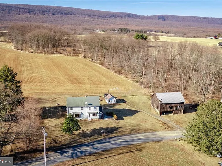 Welcome home to this 1800’s Farmhouse situated on a beautiful back road country lot.