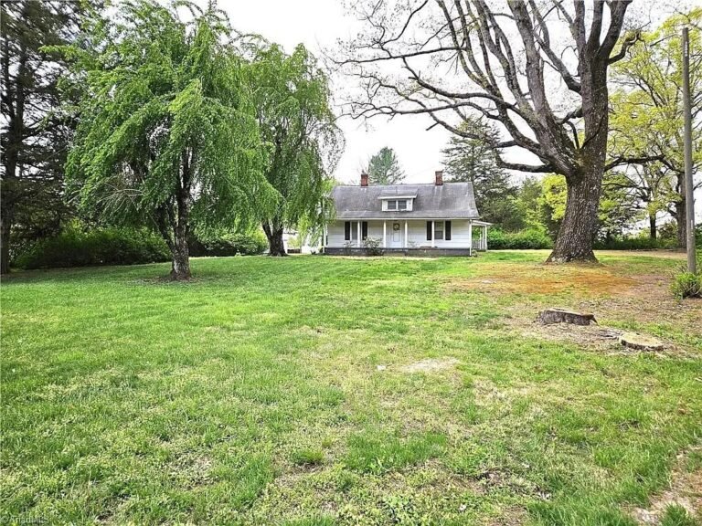 Two-Bedroom Farmhouse with 26.29 Acres on Siloam, North Carolina