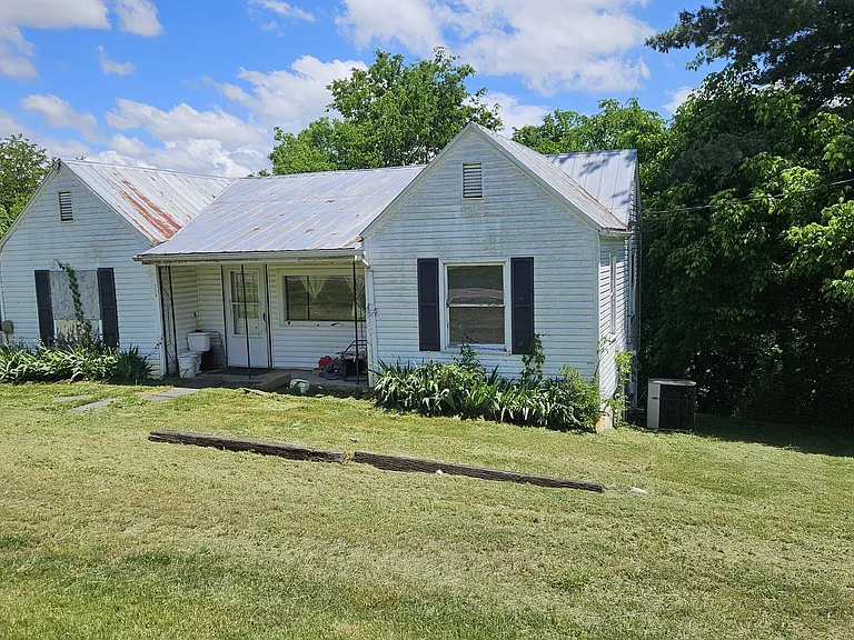 $79,000 Great fixer upper situated on 2.36 subdivideable gently sloping grassy acres and mountain views conveniently