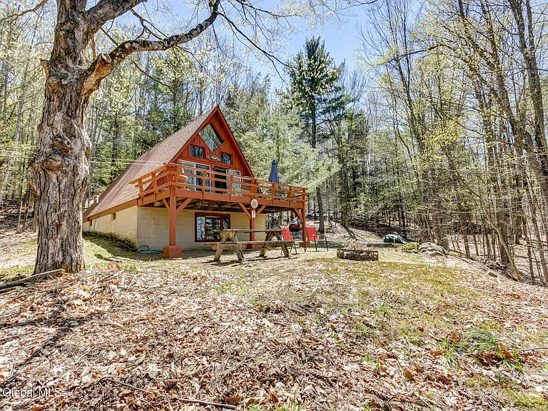 Adirondack A-Frame w/Lake View & 10′ Lake Access. Private wooded setting at the end of a private road.