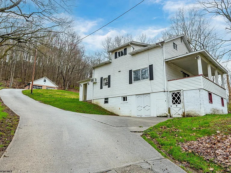 Situated on 4.3 acres, tucked away in a serene, wooded setting, $180,000