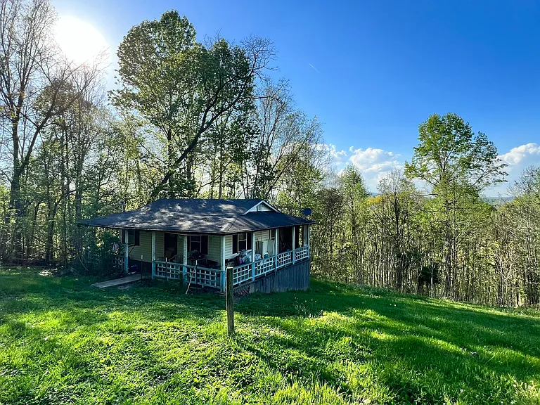 Don’t miss out on this exciting opportunity to own a 2.59 acre mountain top property with two structures, $99,000