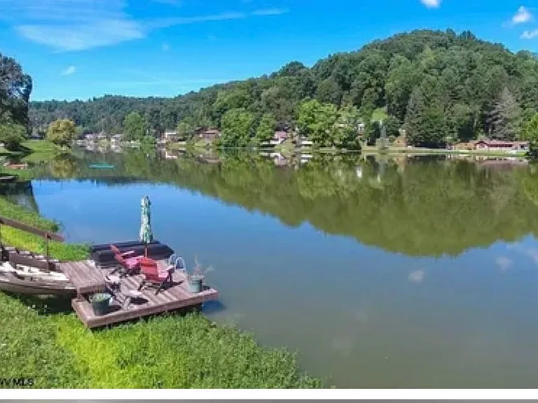 Private setting on 3 1/2 lots, multi level deck, $285,000