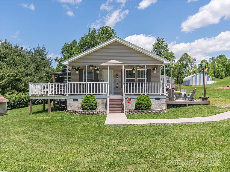 Move-in ready gem just minutes from Asheville! This home is made for both relaxation and entertaining,