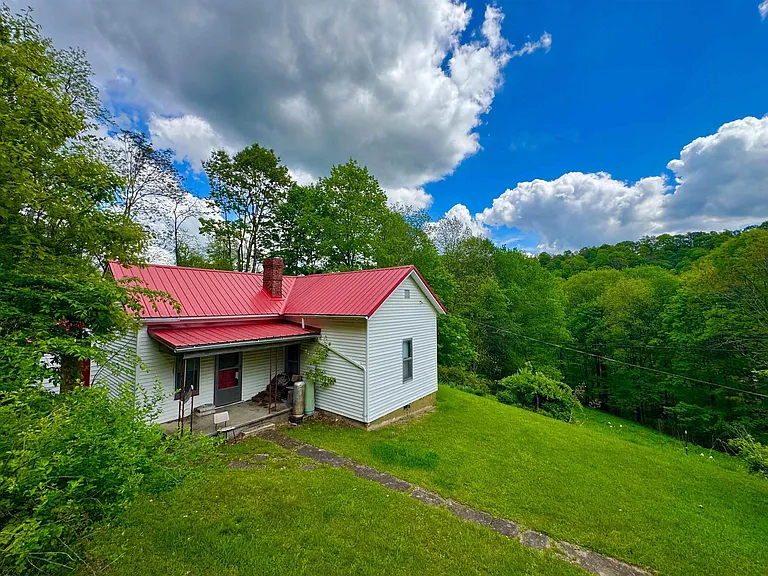 Little Slice of Heaven on 35 +/- ACRES in the heart of the Appalachian Mountains of West Virginia. Enjoy 8 +/- acres of pasture with a 800 sqft farmhouse, 24 X 20 detached garage, and a 25 X 20 barn. $250,000