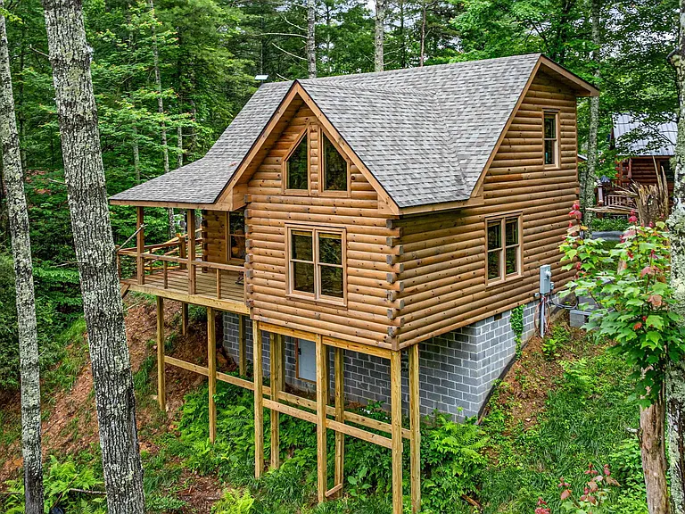 Discover this charming and affordable cabin, an ideal short-term rental investment in today’s competitive market. $439,000