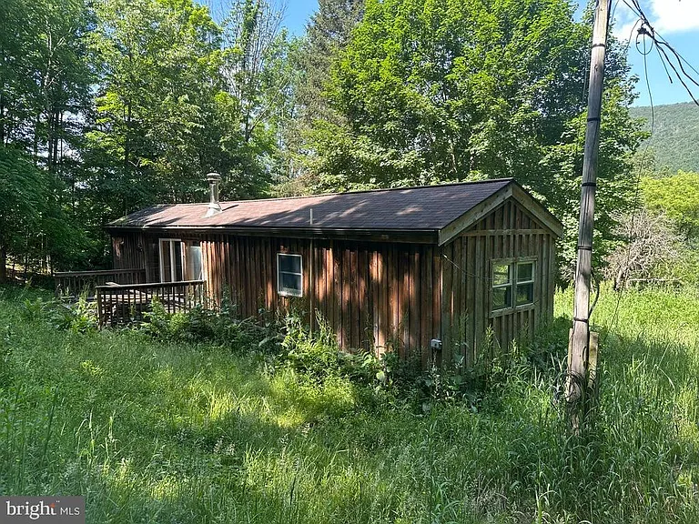 Camp situated on .91 acres of land with a quiet setting, surrounded by nature. $81,500