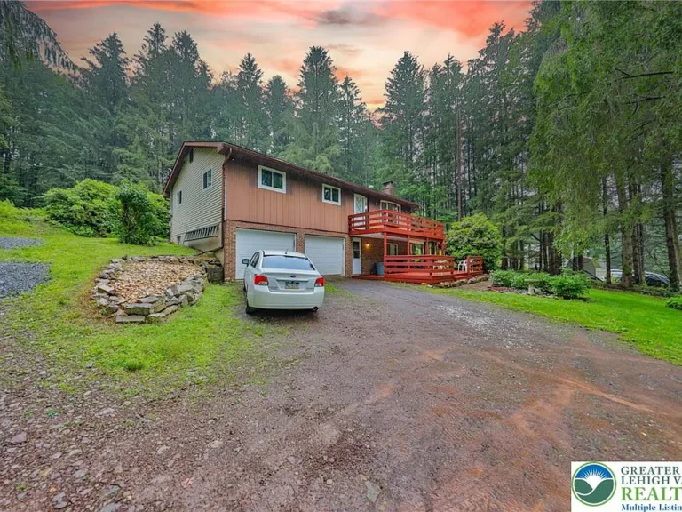 Embrace year-round beauty and privacy in this charming 3-bedroom, 1.5-bath raised ranch nestled deep on 2.278 peaceful acres in desirable Towamensing Township. $320,000