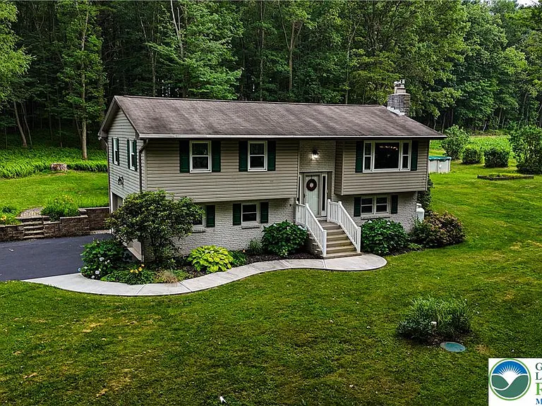 Nestled on just over 2-plus acres of a partially wooded lot, $379,900