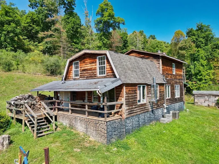 Rustic 4-Bedroom Log Home on 10.16 Acres – A Private Country Retreat! $173,500