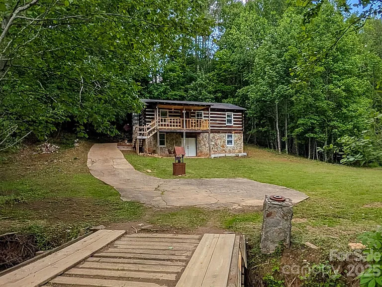 That dream can be your reality with this true log cabin nestled on over 2.04 beautiful acres! $275,000