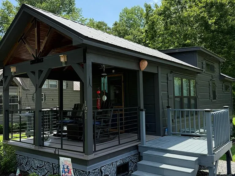 Escape to simplicity and comfort with this beautifully maintained Park Model Log Cabin Tiny Home, $187,500
