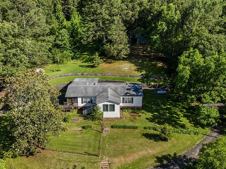 ACREAGE just one and a half mile off I 65. 38-39 acres with two homes on it. PLUS a HALF acre pond. $229,900