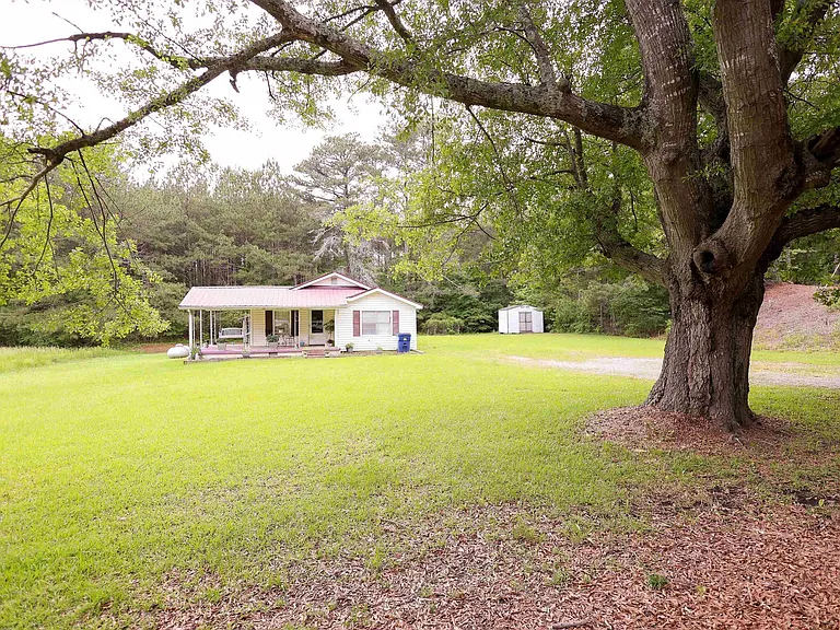 Acreage, and lots of it! Check out this 4.49 acre lot that features a home with 3 bedrooms and 2 bathrooms. $130,000