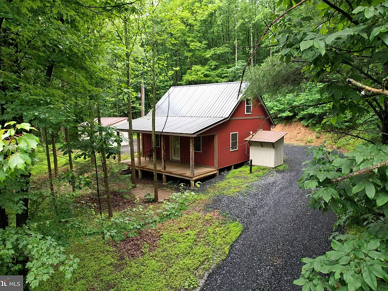 Discover the ultimate escape with this charming cabin set on over 15 acres of unspoiled, wooded land. $230,000
