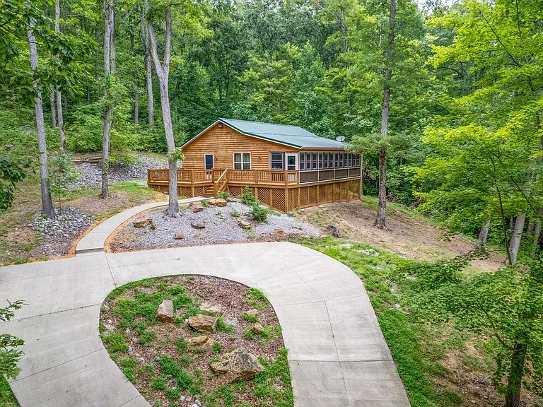 This stunning cabin is perched on 5.66 acres, $297,000