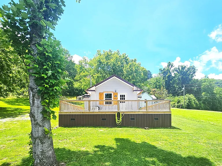 Beautiful cottage style home with a cozy cabin feel inside. $160,000