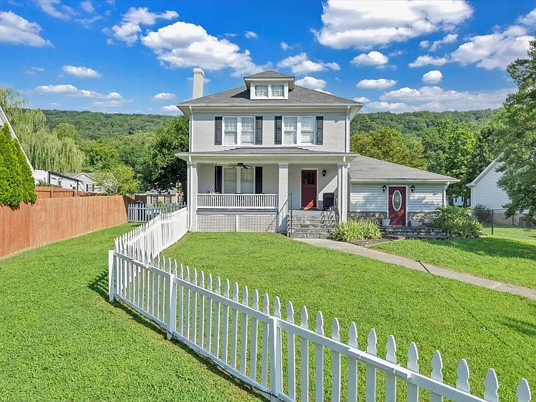 Beautiful, remodeled home with a rocking chair front porch in highly desirable North County Hollins area. $409,500