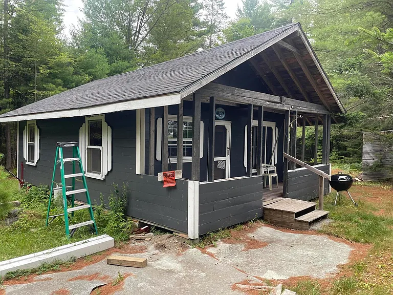 VERY NICE OLD MAINE HUNTING CAMP ON 25 ACS .. WELL WOODED WITH PINE AND SPRUCE  $160,000