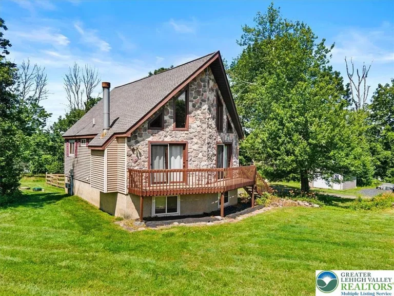 Charming 2 Bed, 3 Bath Chalet on 1.09 Acres in Desirable Hamilton Township! $299,500