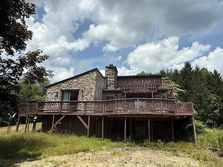 “Hilltop Potential: 49 Acres Near Plum Orchard Lake – A Blank Canvas Awaiting Your Vision”