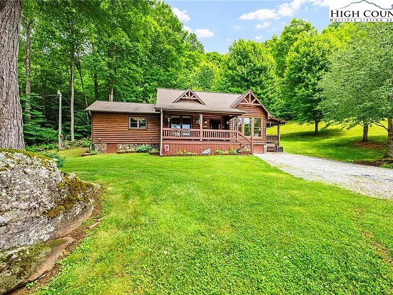 Escape to your ultimate mountain sanctuary! Nestled on 8.5 acres of idyllic, lush forest,