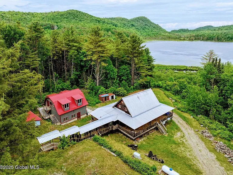 walk out basement and set back from the road with 4.7 acres of wooded privacy.