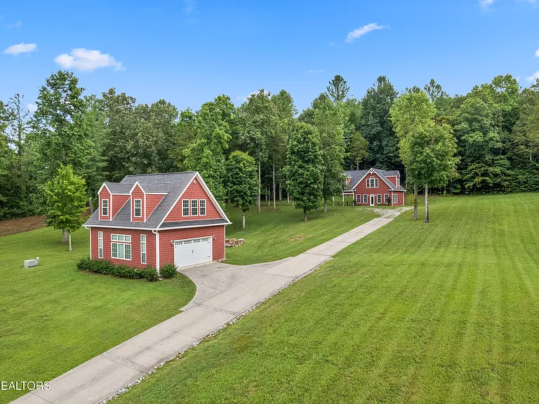 Beautiful lakeview home on 3.1 acres of perfectly manicured yard in Pinnacle Pointe.