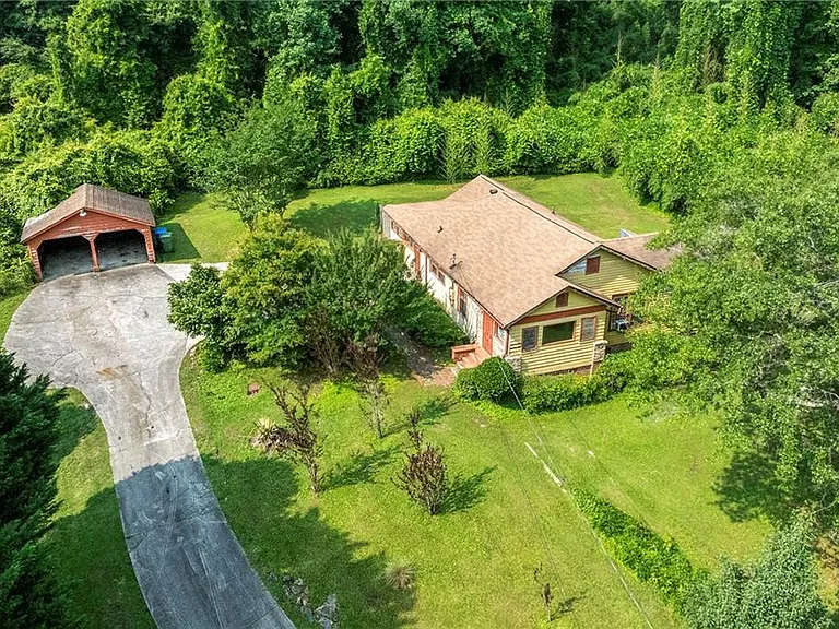 The home sits on a very spacious and mostly cleared 1.5 acre lot with two car detached garage. $185,000