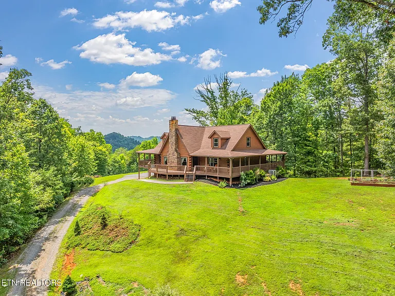 beautifully finished space on 6.79 private, wooded acres—with county-only taxes. Just 19 minutes from downtown Maryville,