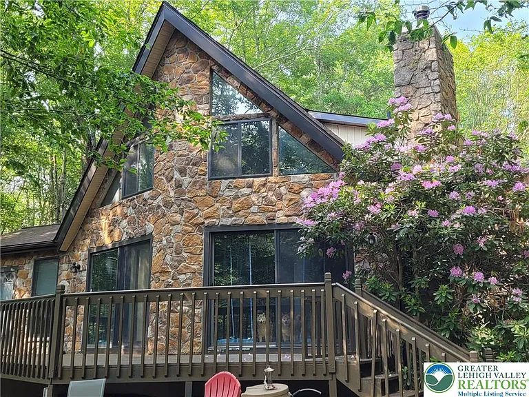 Welcome to your private mountain getaway! Nestled on a rare triple lot totaling 1.45 secluded acres,