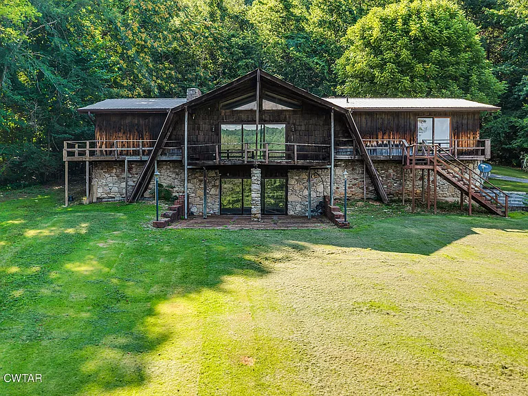 Spacious 181-Acre Rural Retreat with Modern Home, Barn, and Scenic Views in Linden, TN