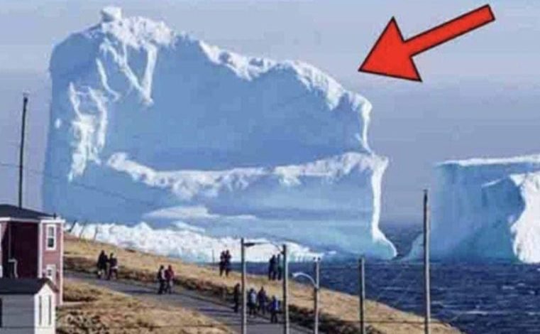 Iceberg floats near the local village. When people see what’s on it, they get scared…