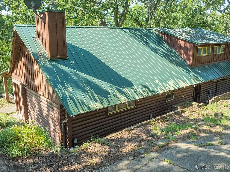 cabin on 1.95 acres is surrounded by mature trees and offers peace, $169,900