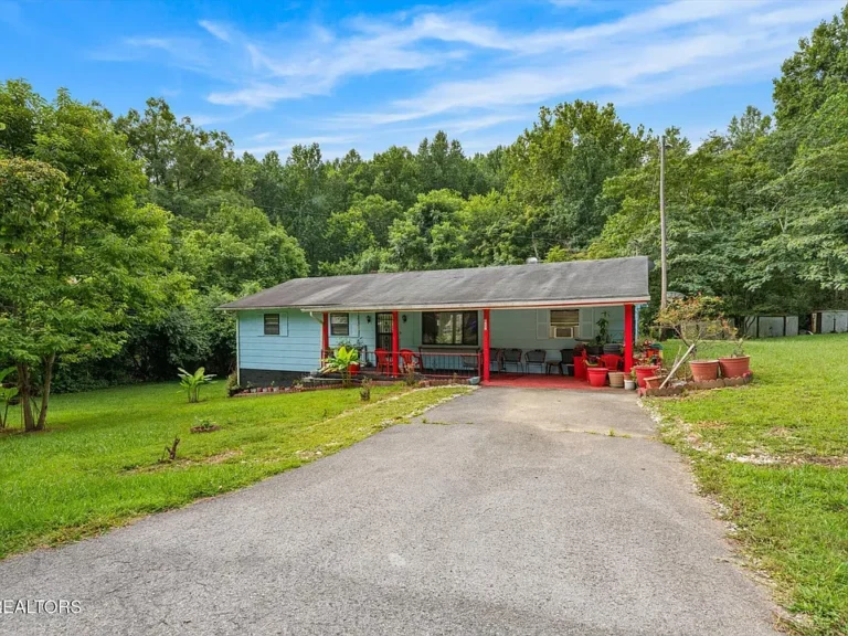 Secluded Ranch Retreat on 1.23 Acres – 3BR/2BA with Sunroom & Porches ✨ $210,000