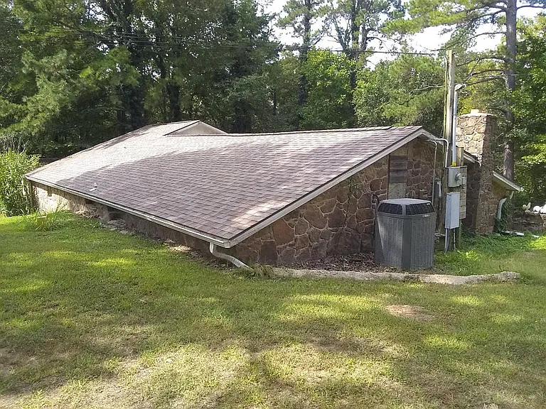 Half underground, 3 bedroom 2 bath finished in an old western theme. $180,000