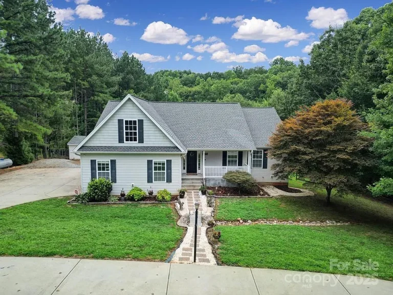Nestled on a private lot surrounded by mature trees, this beautifully designed home offers the perfect balance of comfort, style, and functionality.