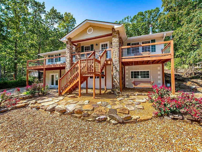 Tucked into a serene, park-like setting, this beautifully  updated home.