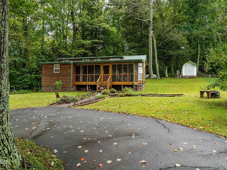 tiny home tucked away on .67 acres in the beautiful..$174,500
