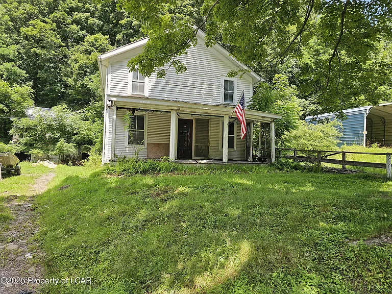 Tucked away on a full acre in the heart of Forkston