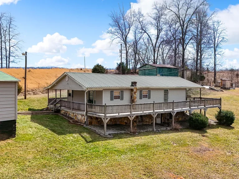 Tennessee Farmhouse with Acreage, Pond, and Mountain Views – A Must-See Country Retreat! $199,990
