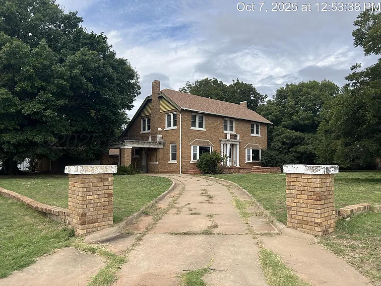 Charming Two-Story Brick Home with Spacious Layout in Memphis, Texas