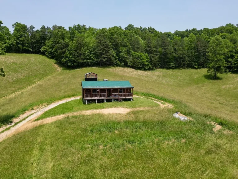 7.7 Acres with Unfinished Cabin & Greenhouse